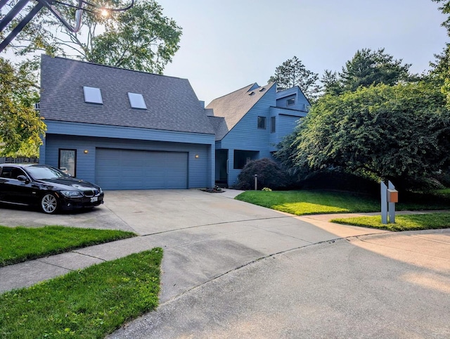 2303 Sumac Ct, Champaign, IL 61821 - view of front facade featuring driveway, a front yard, roof with shingles, and a garage