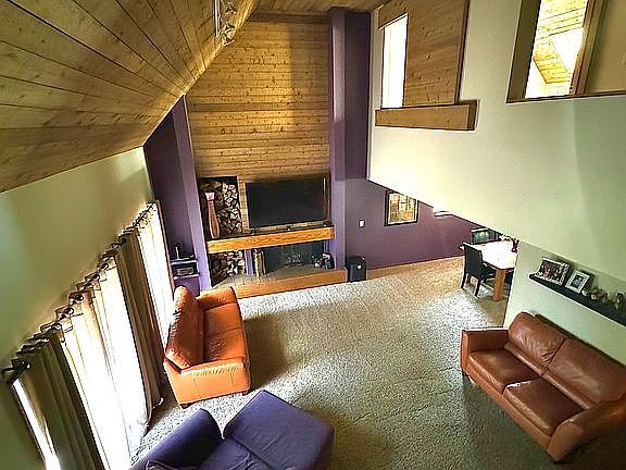 2303 Sumac Ct, Champaign, IL 61821 - sitting room featuring wooden ceiling, lofted ceiling, and wooden walls