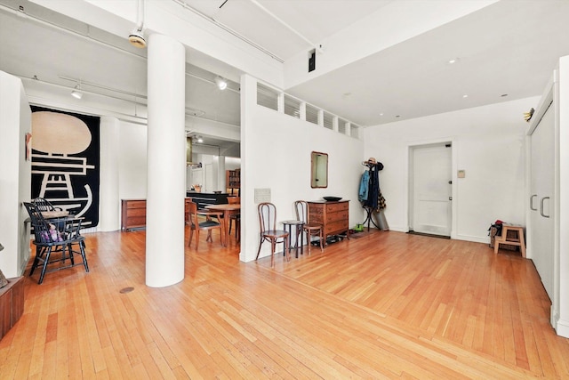 727 S Dearborn St Unit 311, Chicago, IL 60605 - living room with hardwood / wood-style floors, ornate columns, and track lighting