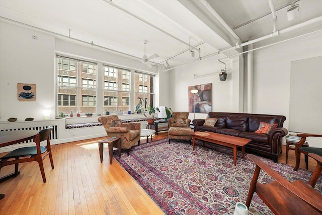 727 S Dearborn St Unit 311, Chicago, IL 60605 - living area with a ceiling fan, light wood-style floors, and rail lighting