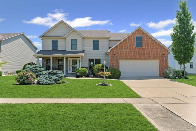 3220 Weeping Cherry Dr, Champaign, IL 61822 - traditional-style home with driveway, a front yard, brick siding, and an attached garage