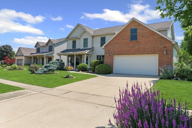 3220 Weeping Cherry Dr, Champaign, IL 61822 - traditional-style home featuring driveway, brick siding, and a front yard