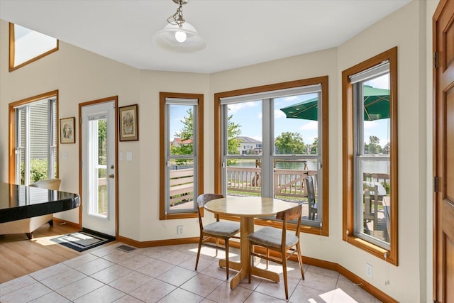 3220 Weeping Cherry Dr, Champaign, IL 61822 - dining space featuring light tile patterned floors and baseboards