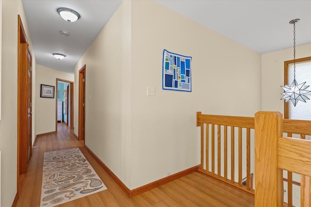 3220 Weeping Cherry Dr, Champaign, IL 61822 - hall with an upstairs landing, light wood-style flooring, and a chandelier