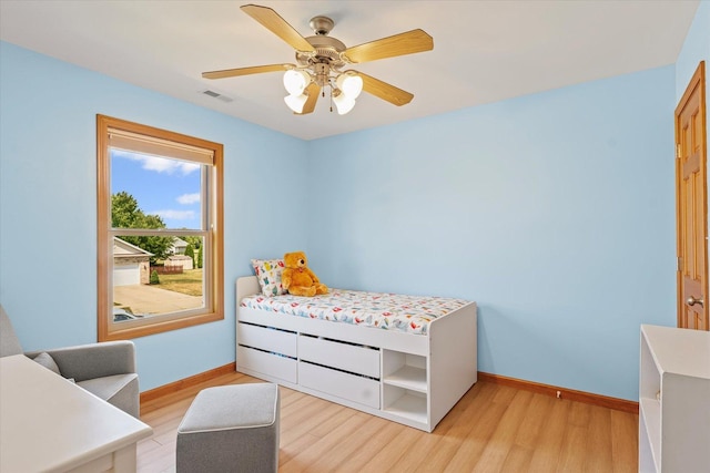 3220 Weeping Cherry Dr, Champaign, IL 61822 - bedroom with light wood-type flooring and a ceiling fan