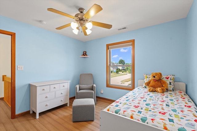 3220 Weeping Cherry Dr, Champaign, IL 61822 - bedroom with light wood-style flooring and a ceiling fan