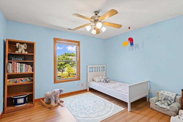 3220 Weeping Cherry Dr, Champaign, IL 61822 - bedroom with wood finished floors and a ceiling fan