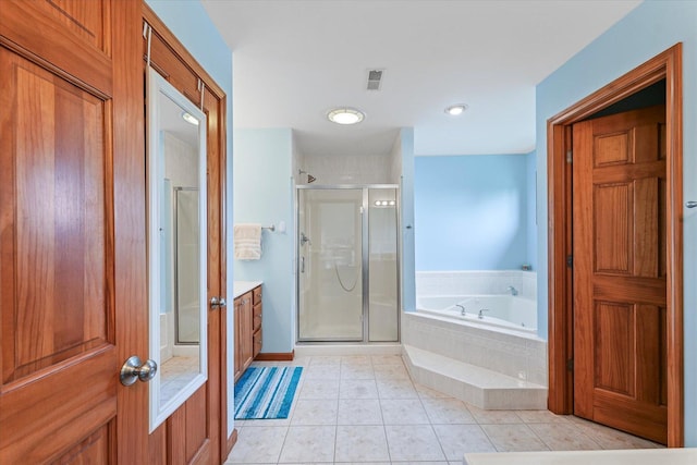 3220 Weeping Cherry Dr, Champaign, IL 61822 - bathroom featuring a stall shower, a garden tub, vanity, and tile patterned flooring