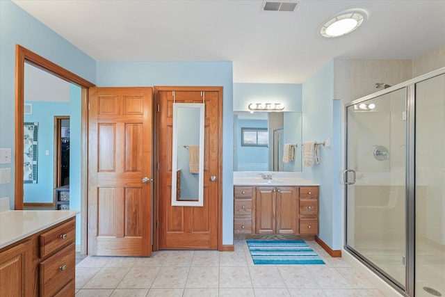 3220 Weeping Cherry Dr, Champaign, IL 61822 - bathroom featuring vanity, a stall shower, and tile patterned floors