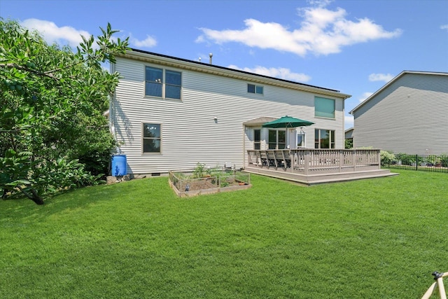 3220 Weeping Cherry Dr, Champaign, IL 61822 - back of house with a wooden deck and a garden