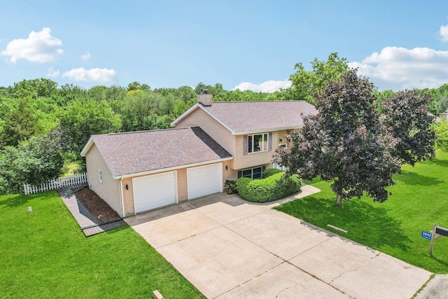 2642 N 3739th Rd, Sheridan, IL 60551 - view of front of property featuring an attached garage, driveway, a chimney, and a shingled roof