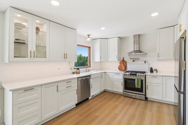2642 N 3739th Rd, Sheridan, IL 60551 - kitchen with wall chimney exhaust hood, stainless steel appliances, light wood finished floors, white cabinets, and recessed lighting