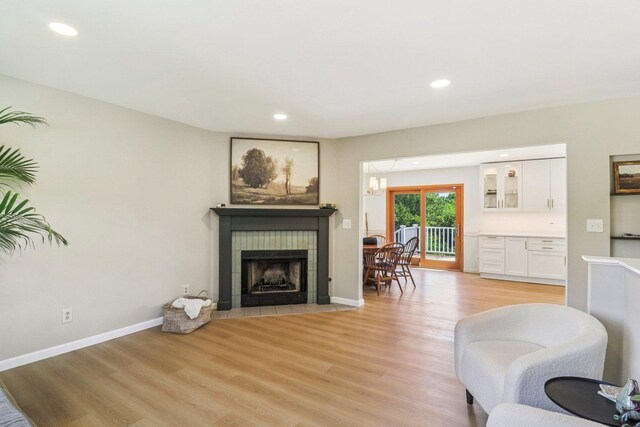 2642 N 3739th Rd, Sheridan, IL 60551 - living room featuring light wood finished floors, a tile fireplace, and recessed lighting