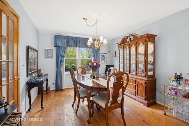 109 N Wilke Rd, Palatine, IL 60074 - dining space with a chandelier and light wood-style floors