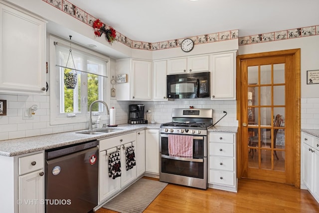 109 N Wilke Rd, Palatine, IL 60074 - kitchen featuring stainless steel appliances, backsplash, white cabinets, and light wood-type flooring