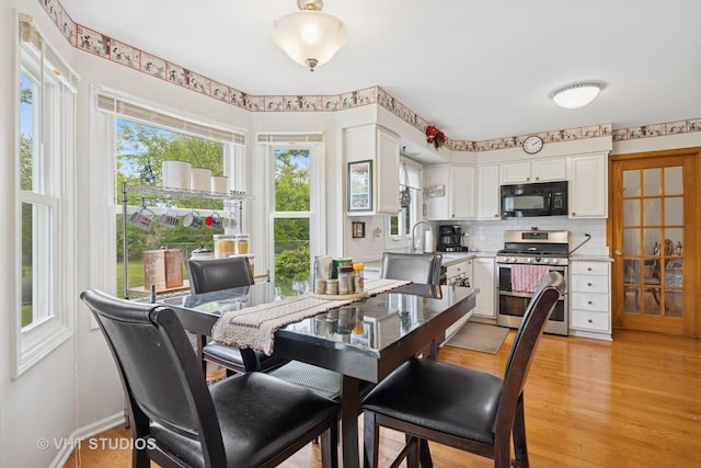109 N Wilke Rd, Palatine, IL 60074 - dining space with light wood-style flooring and baseboards
