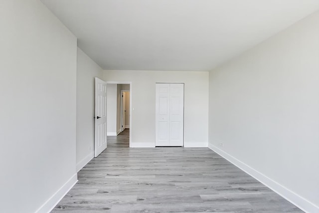 1636 N Wells St Unit 3007, Chicago, IL 60614 - unfurnished bedroom featuring light wood-style flooring and a closet