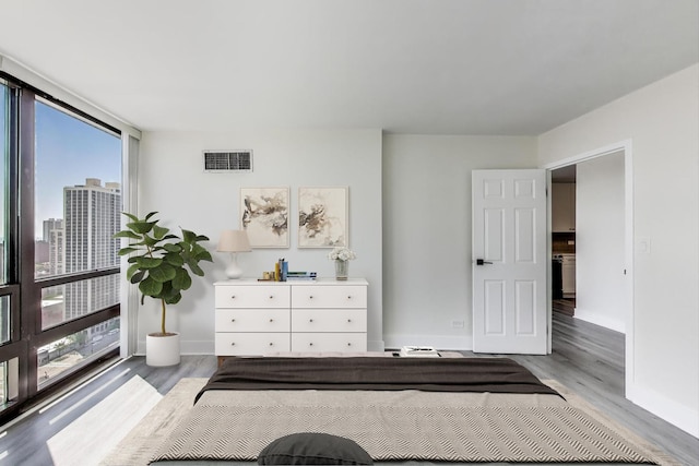 1636 N Wells St Unit 3007, Chicago, IL 60614 - bedroom featuring multiple windows and wood finished floors