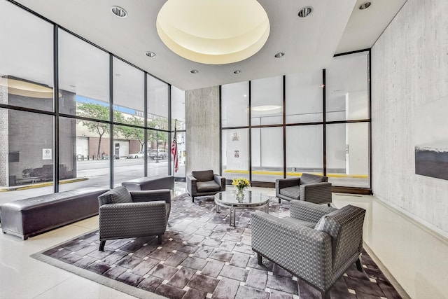1636 N Wells St Unit 3007, Chicago, IL 60614 - building lobby featuring floor to ceiling windows, a towering ceiling, and recessed lighting