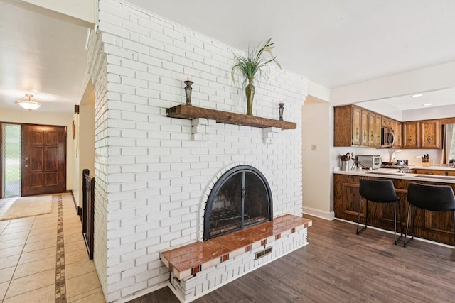13115 Maple Rd, Mokena, IL 60448 - living room featuring a fireplace and wood finished floors
