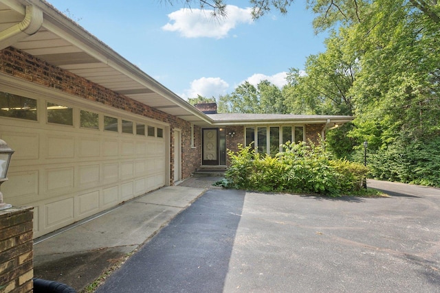 13115 Maple Rd, Mokena, IL 60448 - view of front of house with asphalt driveway, brick siding, and an attached garage