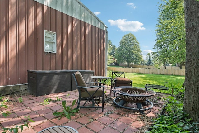 13115 Maple Rd, Mokena, IL 60448 - view of patio featuring an outdoor fire pit and a garage