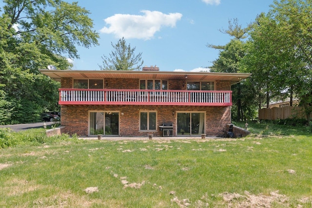 13115 Maple Rd, Mokena, IL 60448 - back of property featuring brick siding, a chimney, and a deck