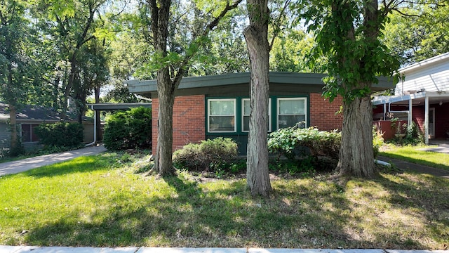 335 Oakwood St, Park Forest, IL 60466 - view of property exterior featuring brick siding and a yard