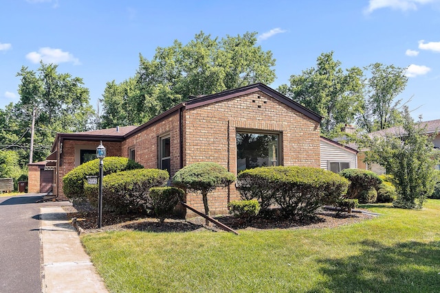 2125 Collett Ln, Flossmoor, IL 60422 - view of front of property with brick siding and a front yard
