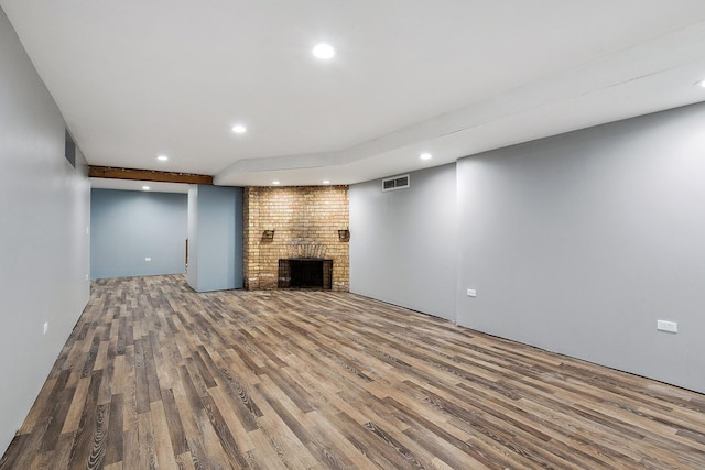 2125 Collett Ln, Flossmoor, IL 60422 - unfurnished living room with wood finished floors, recessed lighting, and a brick fireplace