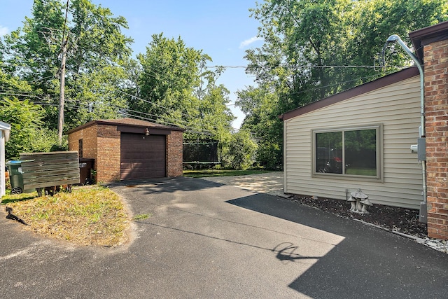 2125 Collett Ln, Flossmoor, IL 60422 - view of patio with an outdoor structure, driveway, and a detached garage