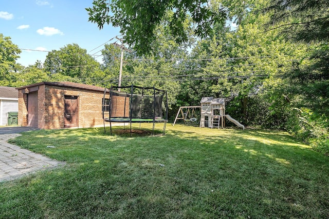 2125 Collett Ln, Flossmoor, IL 60422 - view of green lawn featuring a trampoline, a playground, an outdoor structure, a garage, and driveway