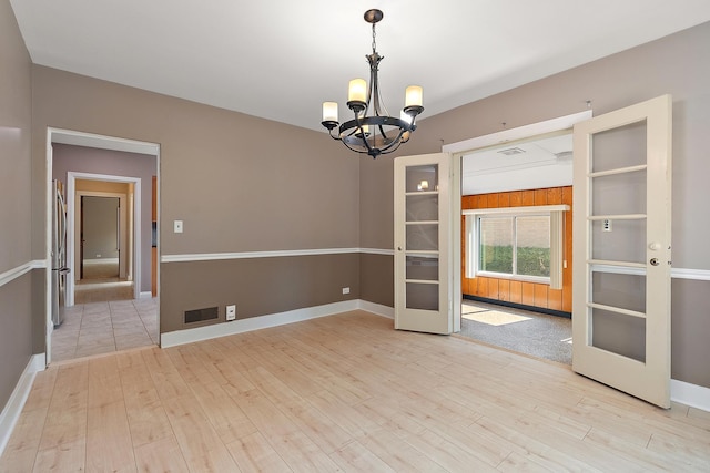 2125 Collett Ln, Flossmoor, IL 60422 - unfurnished room with a chandelier, wood finished floors, and french doors