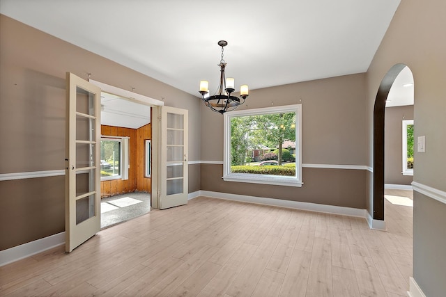 2125 Collett Ln, Flossmoor, IL 60422 - spare room featuring french doors, plenty of natural light, arched walkways, and a chandelier