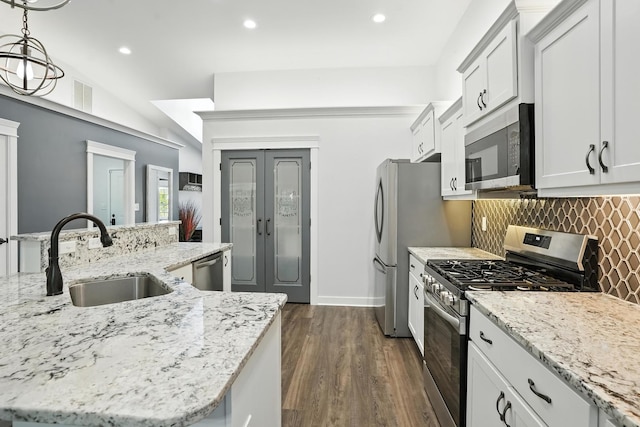 6815 W 142nd Ln, Cedar Lake, IN 46303 - kitchen featuring appliances with stainless steel finishes, dark wood finished floors, decorative backsplash, recessed lighting, and light stone counters