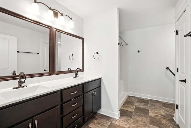 6815 W 142nd Ln, Cedar Lake, IN 46303 - bathroom featuring double vanity, shower / washtub combination, and stone finish floors