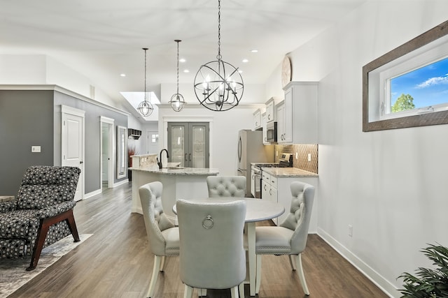 6815 W 142nd Ln, Cedar Lake, IN 46303 - dining space with a chandelier, dark wood finished floors, recessed lighting, and vaulted ceiling
