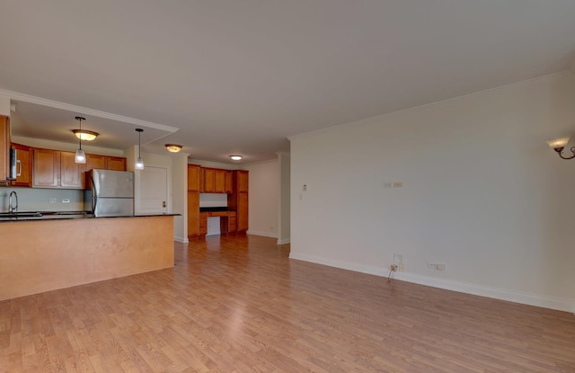 1 Renaissance Pl Unit 1212, Palatine, IL 60067 - unfurnished living room featuring crown molding and light wood-style floors