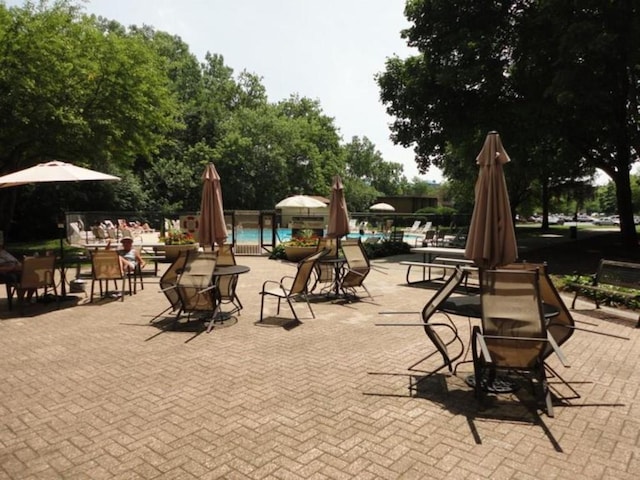 1 Renaissance Pl Unit 1212, Palatine, IL 60067 - view of playground featuring a community pool and a patio