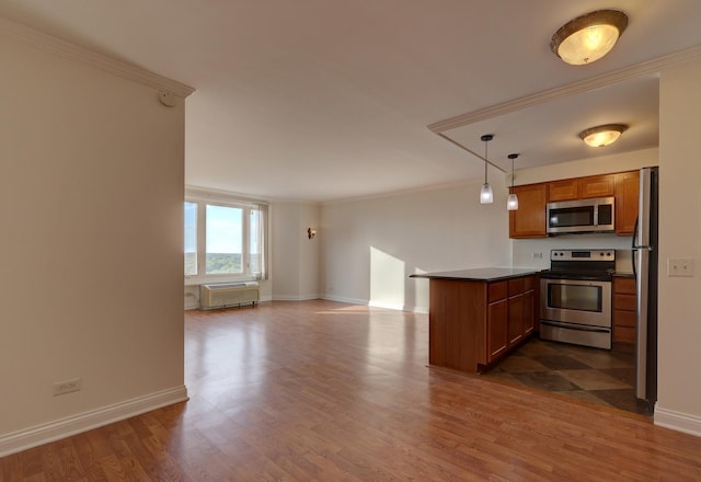 1 Renaissance Pl Unit 1212, Palatine, IL 60067 - kitchen featuring stainless steel appliances, a peninsula, brown cabinets, crown molding, and dark wood finished floors