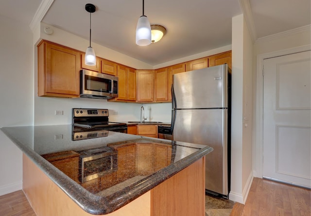 1 Renaissance Pl Unit 1212, Palatine, IL 60067 - kitchen with stainless steel appliances, a peninsula, dark stone countertops, decorative light fixtures, and light wood-style flooring