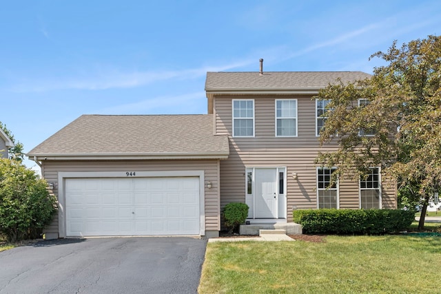 944 W Briarcliff Rd, Bolingbrook, IL 60440 - colonial-style house featuring driveway, a front lawn, and an attached garage