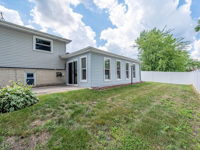 824 E 193rd Pl, Glenwood, IL 60425 - back of house featuring a fenced backyard and a patio area