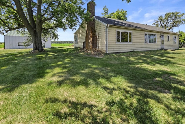 2489 E US Highway 52, Donovan, IL 60931 - view of home's exterior with a chimney and a yard