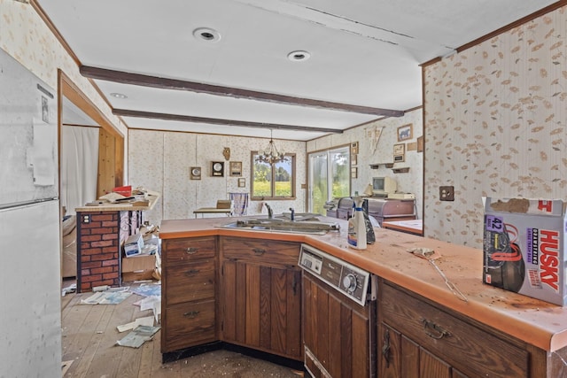 2489 E US Highway 52, Donovan, IL 60931 - kitchen featuring dishwashing machine, wallpapered walls, hardwood / wood-style floors, freestanding refrigerator, and light countertops
