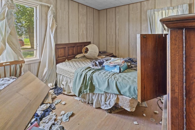 2489 E US Highway 52, Donovan, IL 60931 - bedroom with multiple windows, wood-type flooring, and wood walls