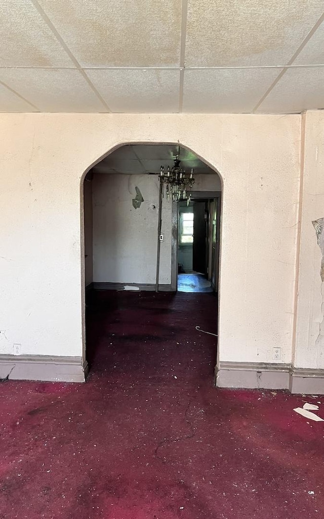 9036 S Houston Ave, Chicago, IL 60617 - hallway featuring arched walkways, carpet flooring, and a drop ceiling