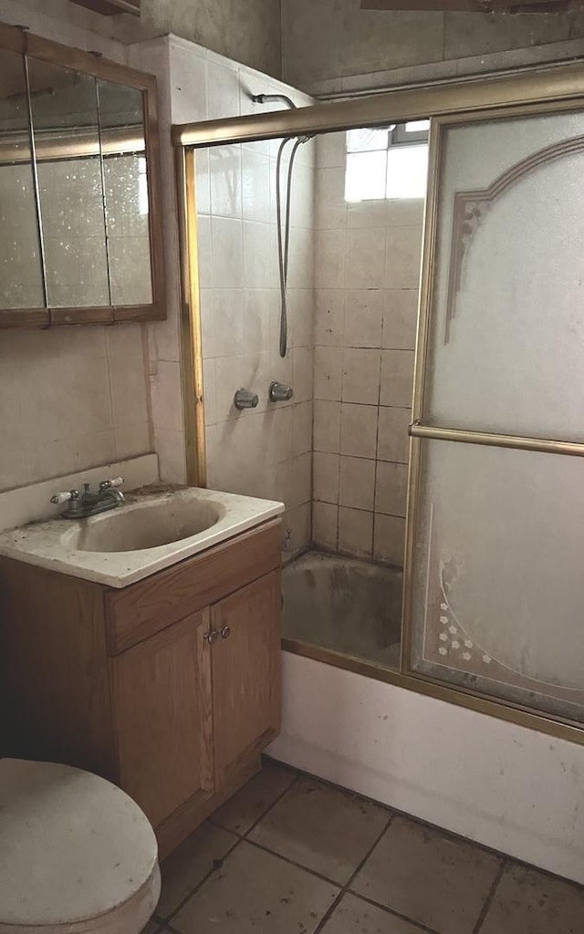 9036 S Houston Ave, Chicago, IL 60617 - bathroom with vanity, bath / shower combo with glass door, and tile patterned flooring