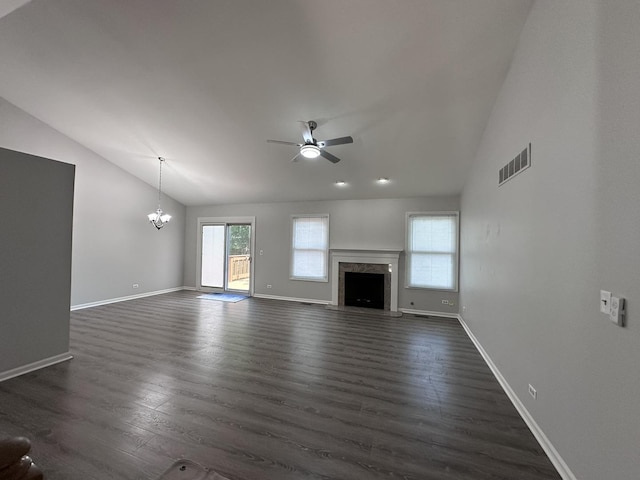 4075 Peartree Dr, Lake In The Hills, IL 60156 - unfurnished living room featuring vaulted ceiling, a ceiling fan, dark wood finished floors, a chandelier, and a high end fireplace