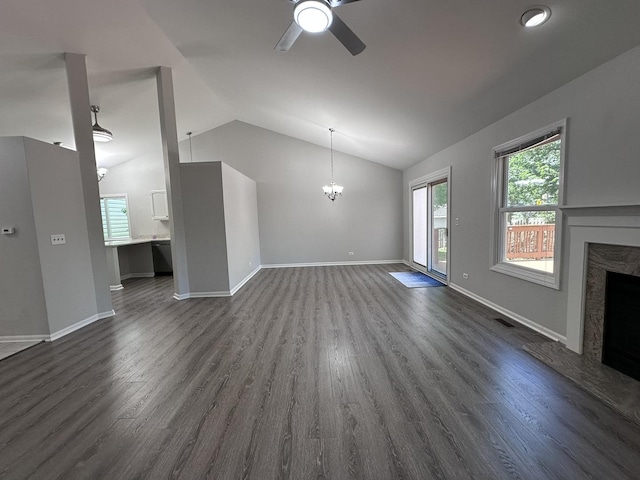 4075 Peartree Dr, Lake In The Hills, IL 60156 - unfurnished living room with a fireplace, a ceiling fan, dark wood finished floors, a chandelier, and vaulted ceiling